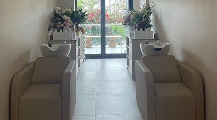 Elegant wash stations at Vital Skin Aesthetics, Birchgrove, New South Wales, AU, featuring fresh floral decor.