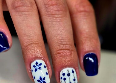 Nail art with blue and white designs at Anne's Nail Salon, Pretoria, Gauteng, ZA.