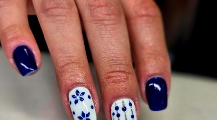 Nail art with blue and white designs at Anne's Nail Salon, Pretoria, Gauteng, ZA.