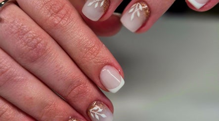 French manicure with delicate leaf design at Anne's Nail Salon, Pretoria, Gauteng, ZA.