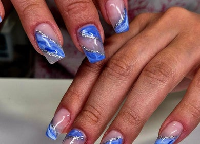 Stunning blue and silver nail art at Anne's Nails & Toes, Pretoria, Gauteng, ZA, showcasing expert design.