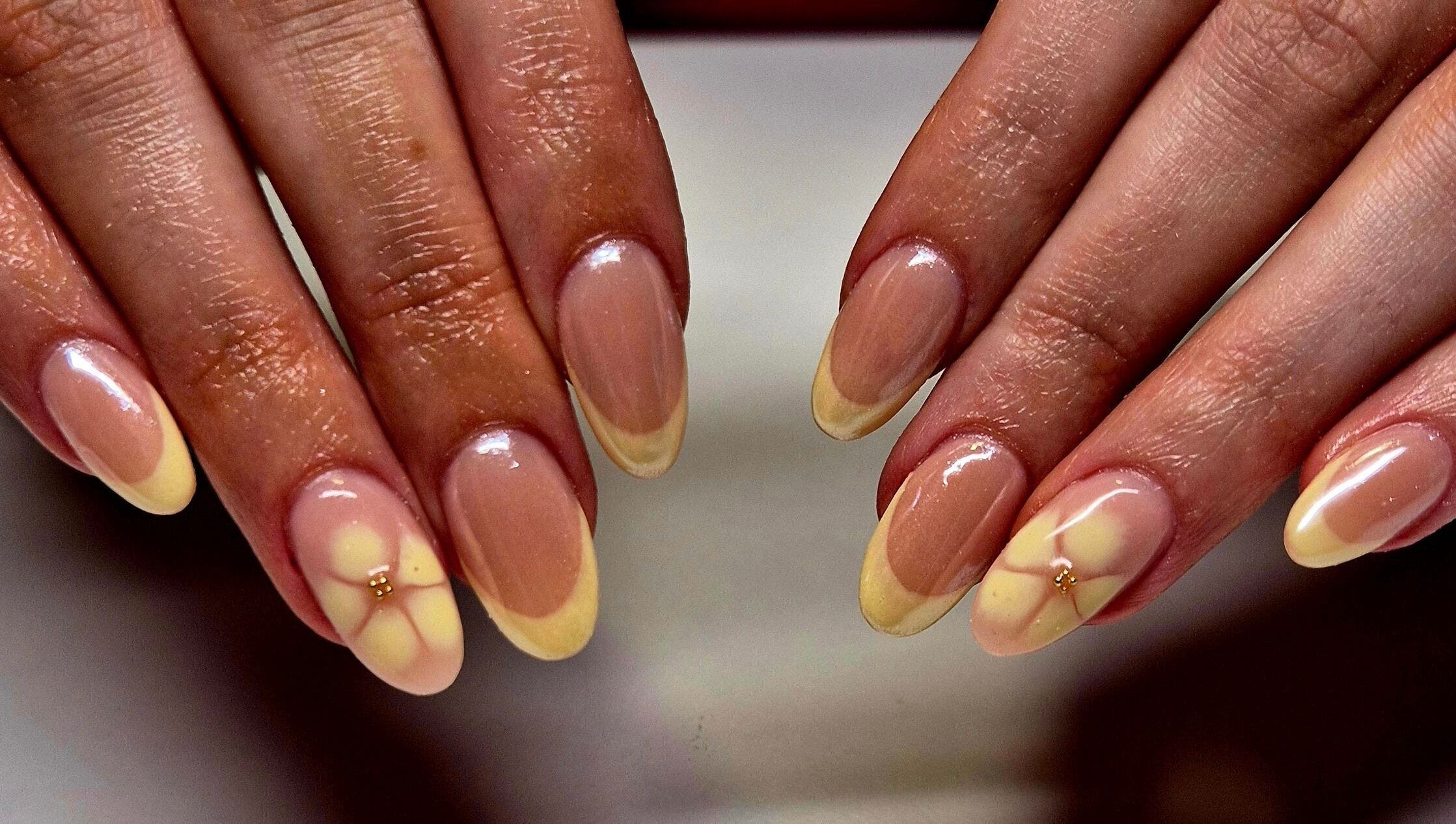 Floral nail art at Anne's Nails & Toes, Pretoria, Gauteng, ZA, showcasing intricate, glossy designs.