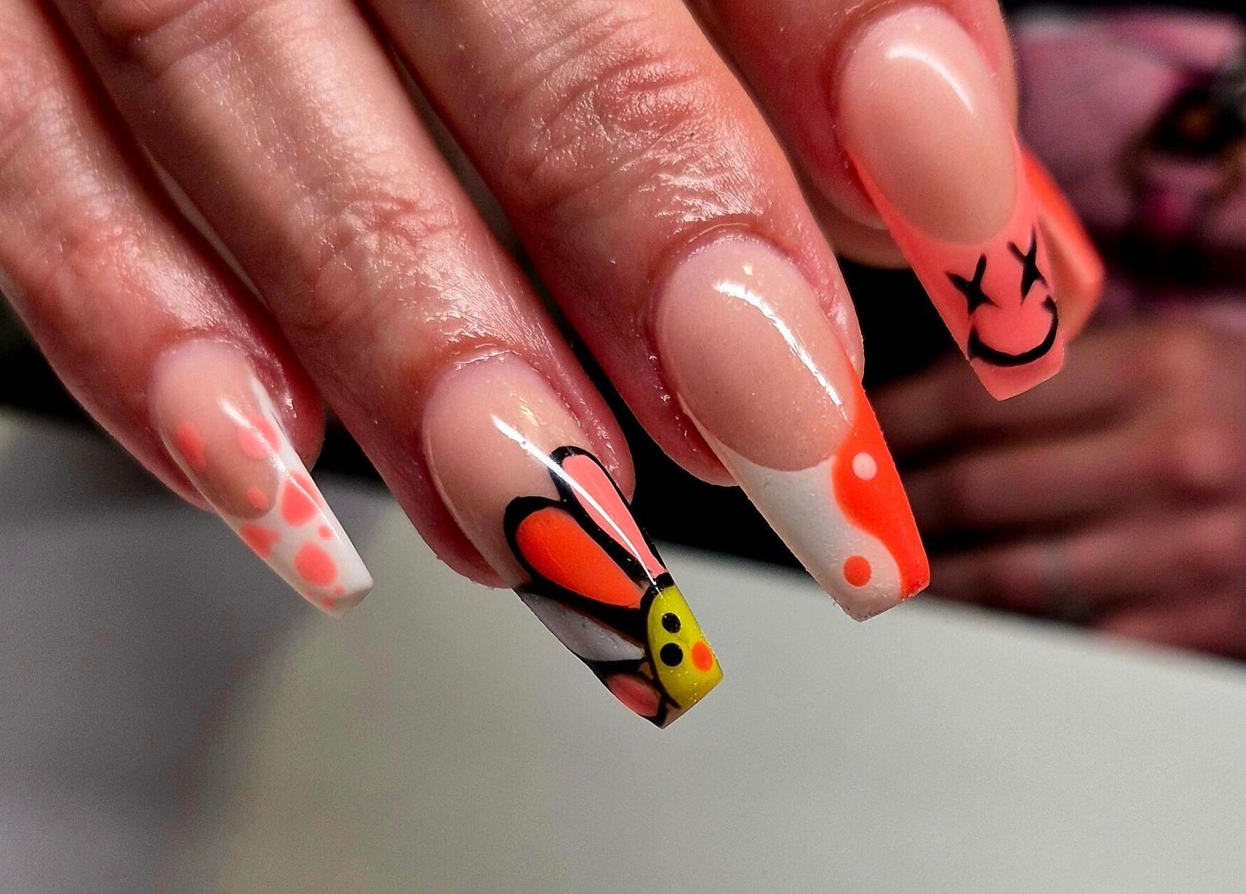 Creative nail art with vibrant butterfly design at Anne's Nails & Toes in Pretoria, Gauteng, ZA.