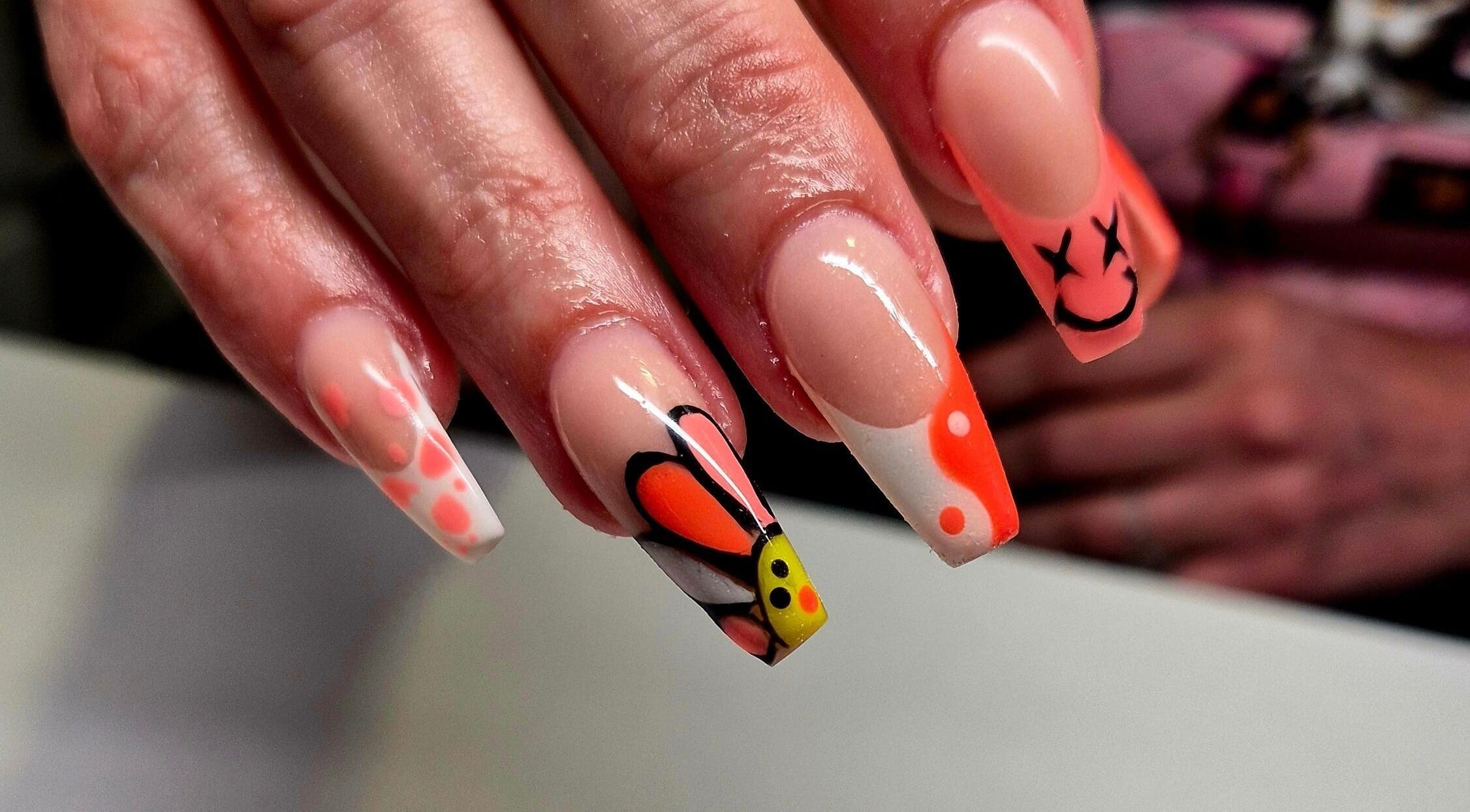 Creative nail art with vibrant butterfly design at Anne's Nails & Toes in Pretoria, Gauteng, ZA.