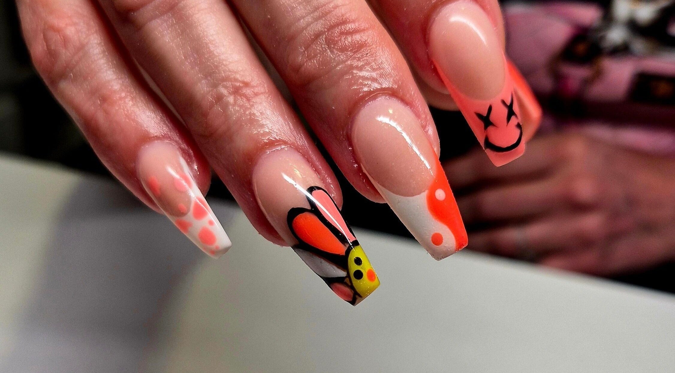Creative nail art with vibrant butterfly design at Anne's Nails & Toes in Pretoria, Gauteng, ZA.