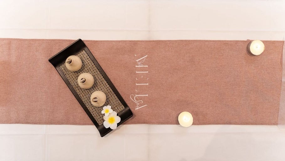 Elegant spa table setup at Melia Spa - Home Service in Riyadh, Riyadh Province, SA, with candles and decor.
