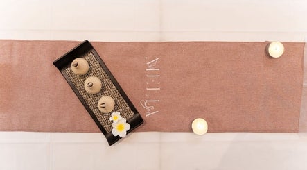Elegant spa table setup at Melia Spa - Home Service in Riyadh, Riyadh Province, SA, with candles and decor.