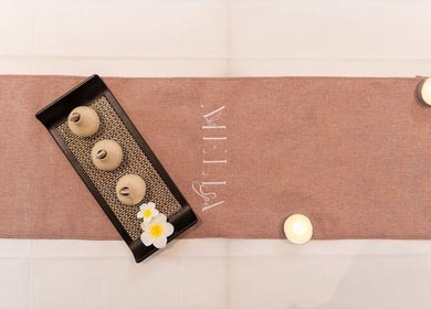 Zen ambiance at Melia Spa - Home Service in Riyadh, Riyadh Province, SA with candles and flowers.