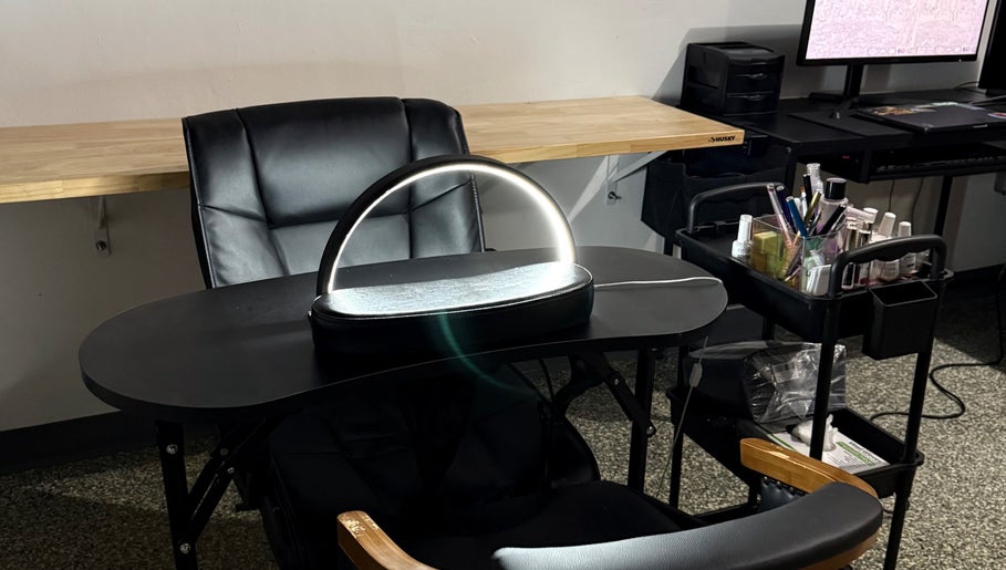 Nail care station at Glow Studio Coral Springs, Coral Springs, Florida, US with manicure tools and modern decor.