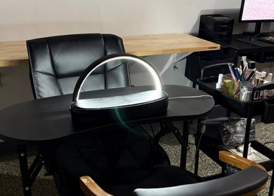 Nail care station at Glow Studio Coral Springs, Coral Springs, Florida, US with manicure tools and modern decor.
