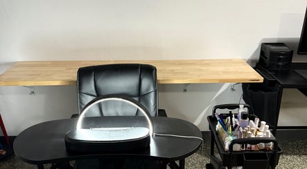 Modern nail station at Glow Studio Coral Springs, Coral Springs, Florida, US with sleek seating and nail supplies.