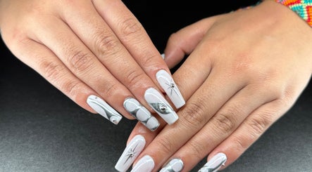 Elegant silver and white nail art at Glow Studio Coral Springs, Coral Springs, Florida, US.