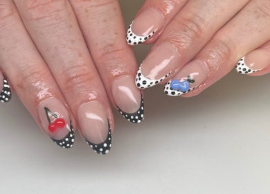 Intricate polka dot nail art featuring cherries at ÀTÍKÉ LONDON, London, England, GB.