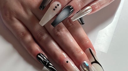 Stylish black and white nail art at ÀTÍKÉ LONDON, London, England, GB, showcasing intricate designs.