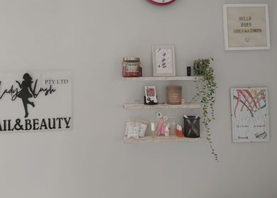 Stylish wall decor at Lady Lush Nails & Beauty, Cape Town, Western Cape, ZA, featuring elegant nail art displays.