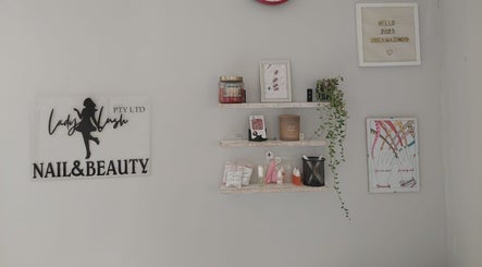 Stylish wall decor at Lady Lush Nails & Beauty, Cape Town, Western Cape, ZA, featuring elegant nail art displays.