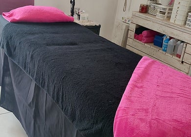 Relaxing treatment room at Lady Lush Nails & Beauty, Cape Town, Western Cape, ZA with pink and black decor.