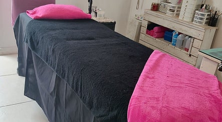 Relaxing treatment room at Lady Lush Nails & Beauty, Cape Town, Western Cape, ZA with pink and black decor.