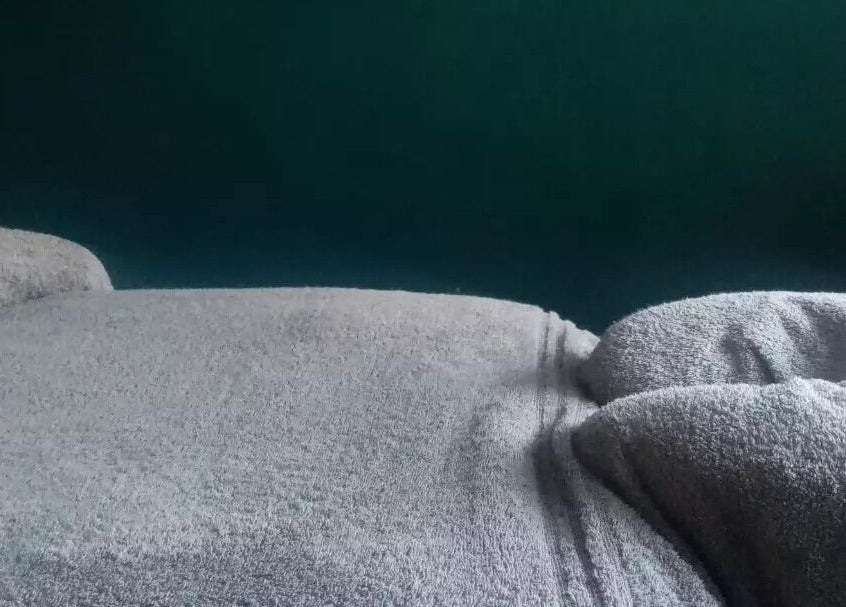 Relaxing massage setting at Holistic BodyWork with Erica in Leeds, England, GB with soft towels and calm ambiance.