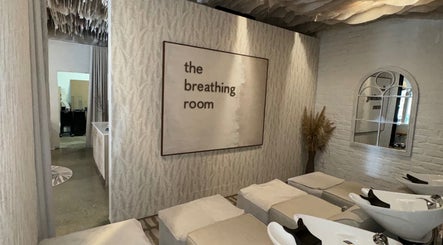 Relaxing shampoo area at BHAVA Hair Lounge, Gqeberha, Eastern Cape, ZA, featuring cozy seating and elegant decor.