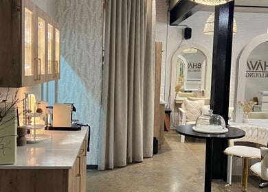 Elegant interior of BHAVA Hair Lounge in Gqeberha, Eastern Cape, ZA with cozy seating and chic decor.