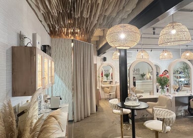 Stylish interior of BHAVA Hair Lounge in Gqeberha, Eastern Cape, ZA featuring chic decor and salon stations.