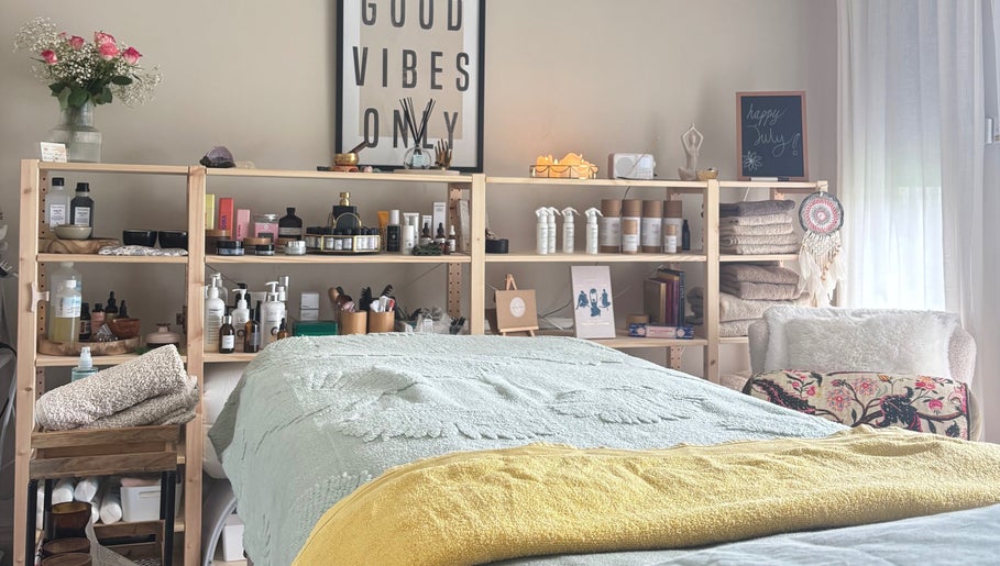 Relaxing spa room at Ataraxy with Abby, Blantyre, Scotland, GB featuring a cozy massage table and calming decor.