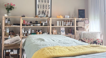 Relaxing spa room at Ataraxy with Abby, Blantyre, Scotland, GB featuring a cozy massage table and calming decor.