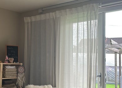 Serene interior of Ataraxy with Abby, Blantyre, Scotland, GB, featuring soft curtains and cozy decor.