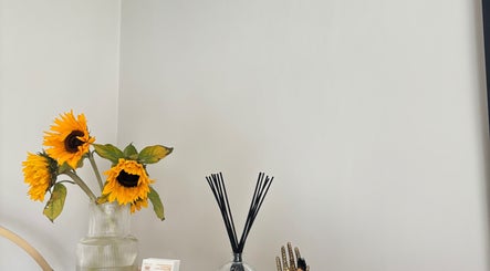 Elegant sunflowers and diffuser at Ataraxy with Abby, Blantyre, Scotland, GB create a serene ambiance.