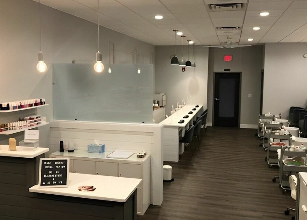 Elegant interior of Max Studio Nails and More in Highwood, Illinois, US, showcasing modern nail service stations.