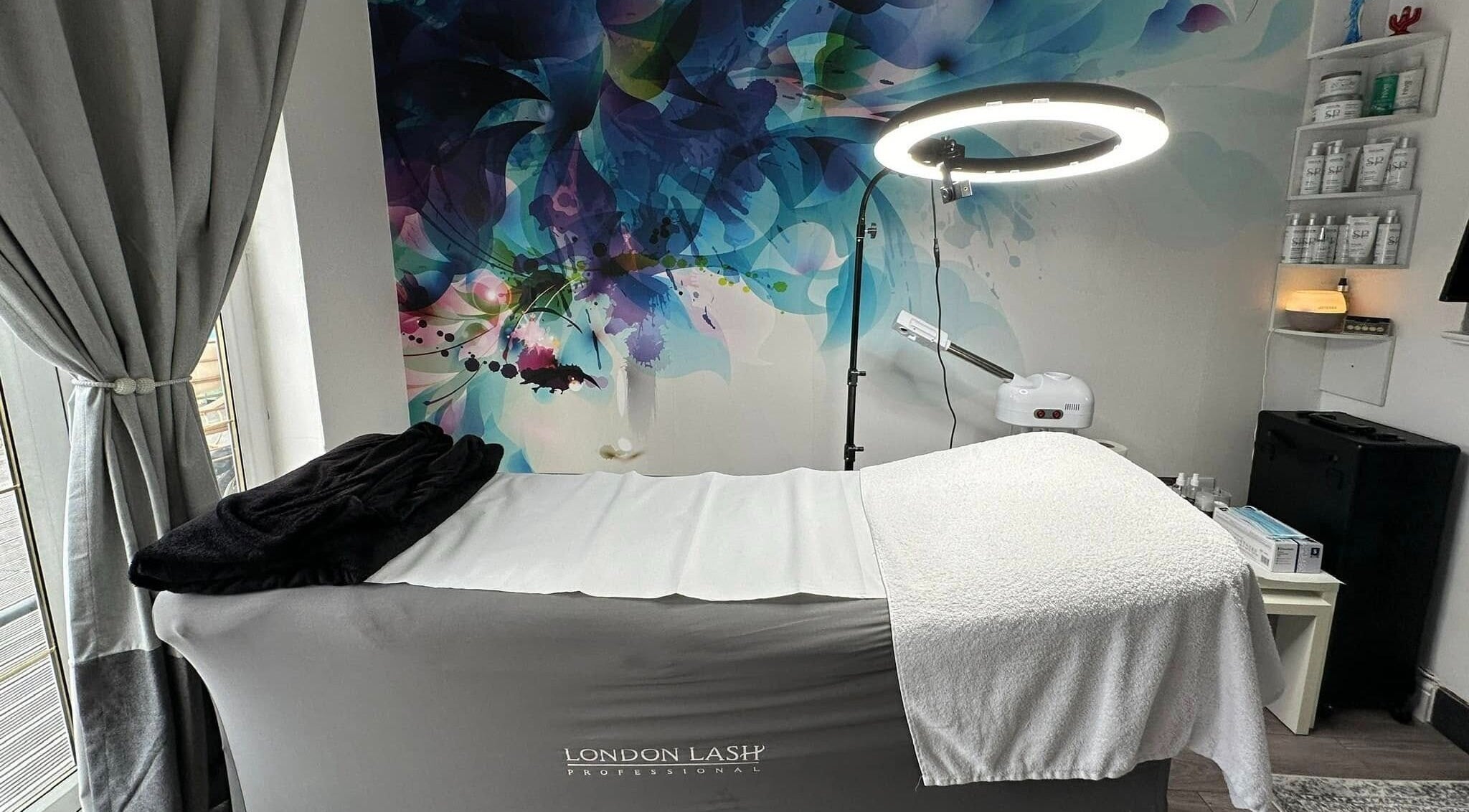 Stylish treatment room at AR Beauty Bar in Stevenage, England, GB featuring a modern lash extension setup.