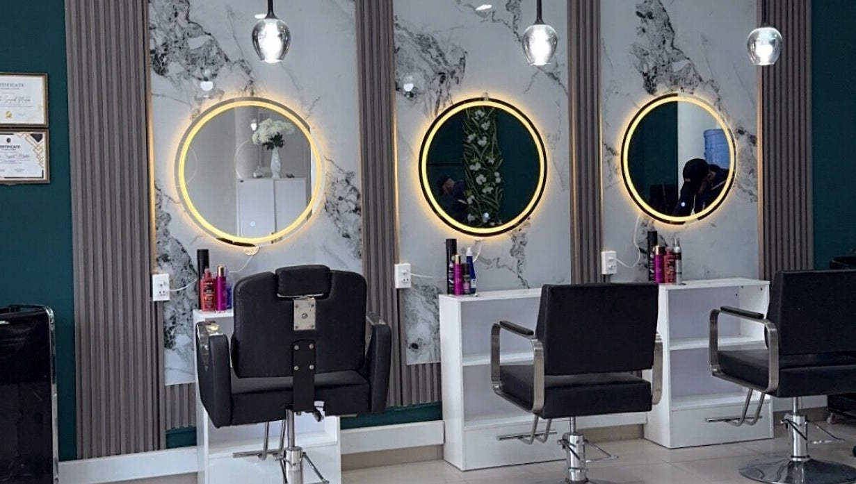 Modern styling chairs and illuminated mirrors at Le Studio De Malik, Paramaribo, Paramaribo, SR.