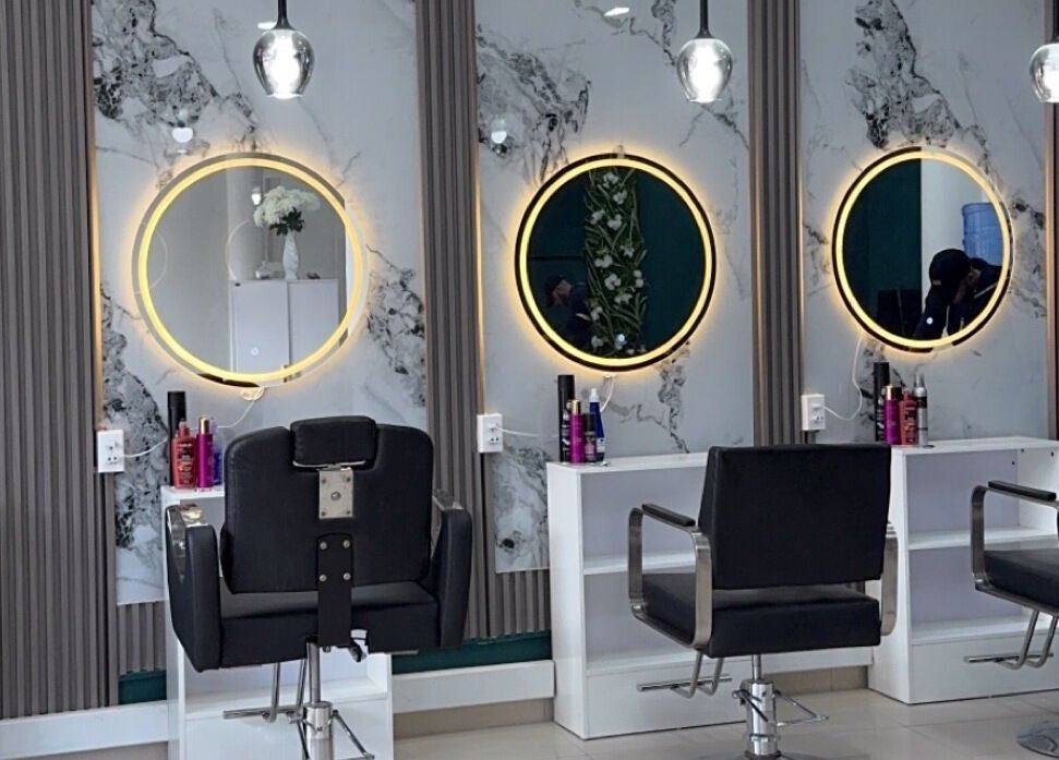 Modern styling chairs and illuminated mirrors at Le Studio De Malik, Paramaribo, Paramaribo, SR.