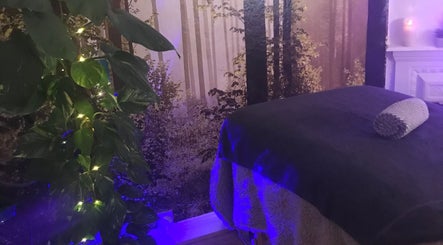 Relaxing therapy room at Rose Holistics in Bolton, England, GB, featuring cozy decor and soft lighting.