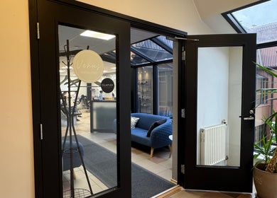 Open doors reveal Iluteenindaja Kersti's inviting interior in Pärnu, Pärnu Maakond, EE, with sleek design elements.