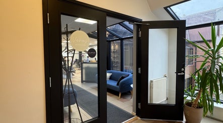 Open doors reveal Iluteenindaja Kersti's inviting interior in Pärnu, Pärnu Maakond, EE, with sleek design elements.