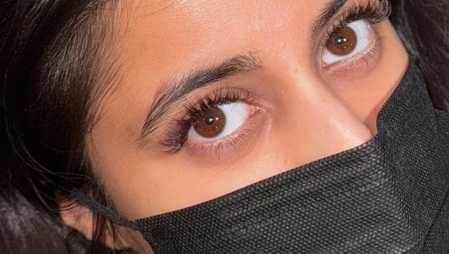 Close-up of elegant eye makeup at RS BEAUTY, Birmingham, England, GB, showcasing natural lash extensions.