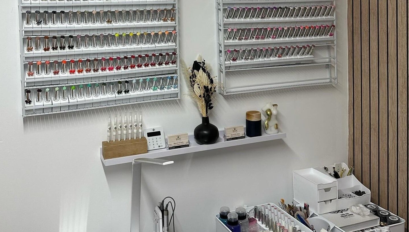 Nail polish display at Beehive By Charlotte, New Tupton, England, GB showcases vibrant colors.