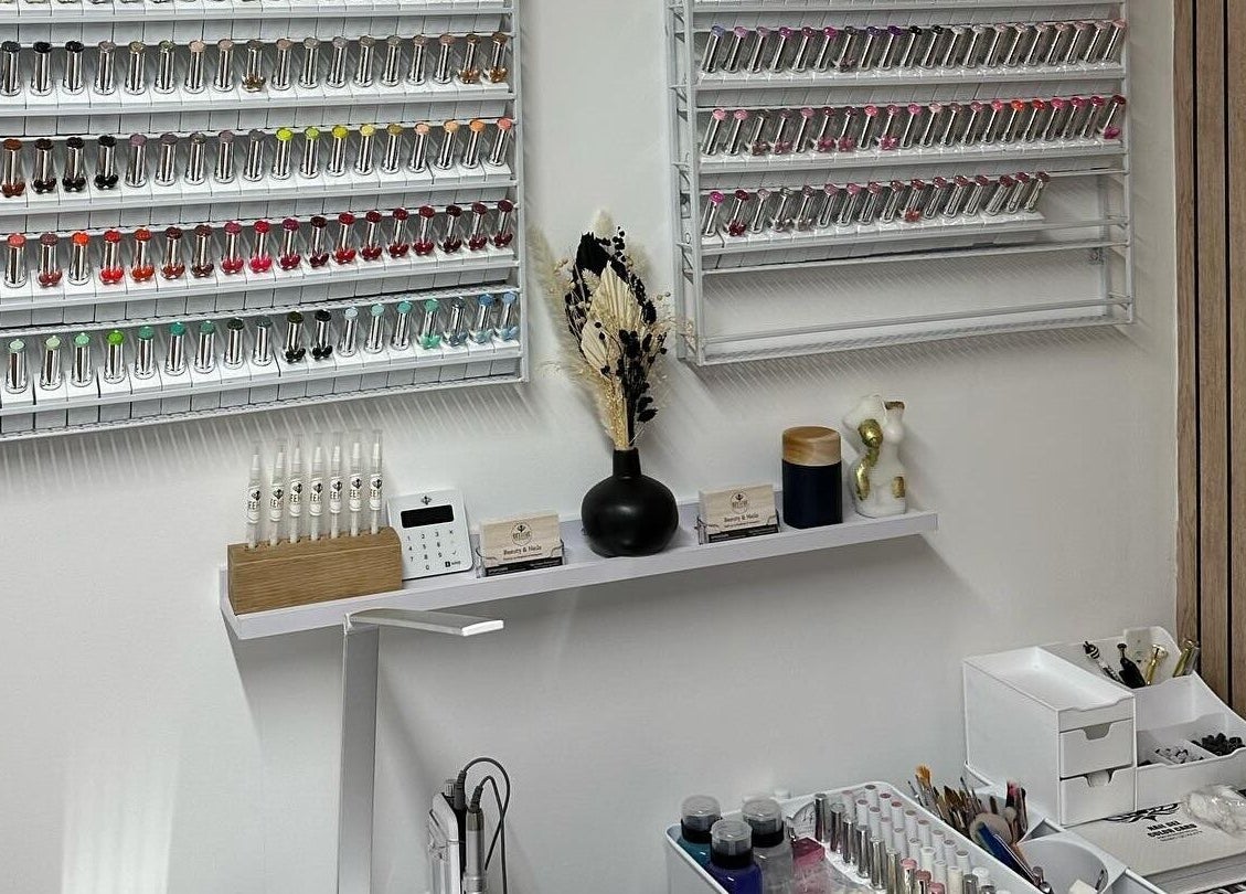 Nail polish display at Beehive By Charlotte, New Tupton, England, GB showcases vibrant colors.