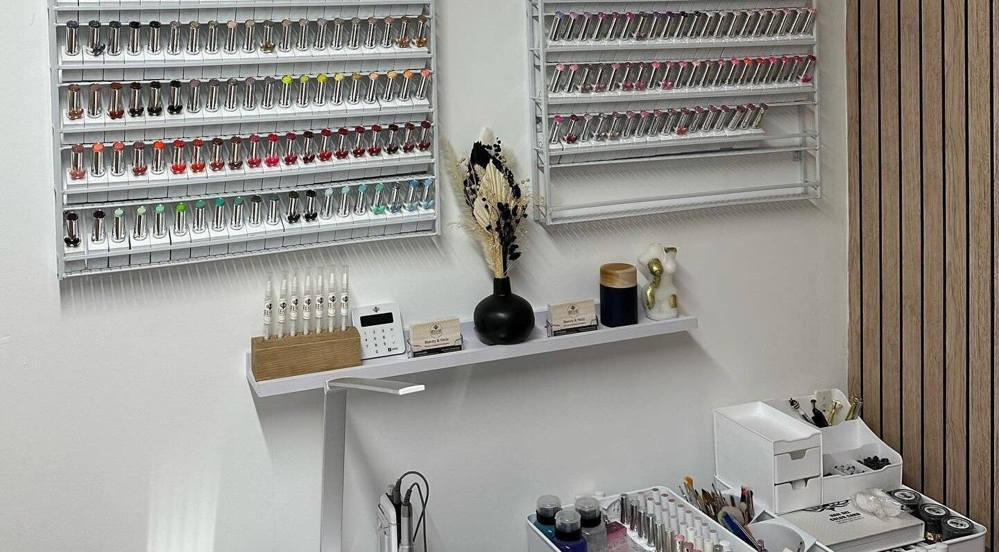 Nail polish display at Beehive By Charlotte, New Tupton, England, GB showcases vibrant colors.