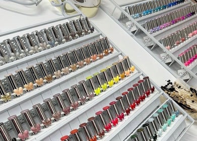 Colorful nail polish collection at Beehive By Charlotte in New Tupton, England, GB, showcasing vibrant options.