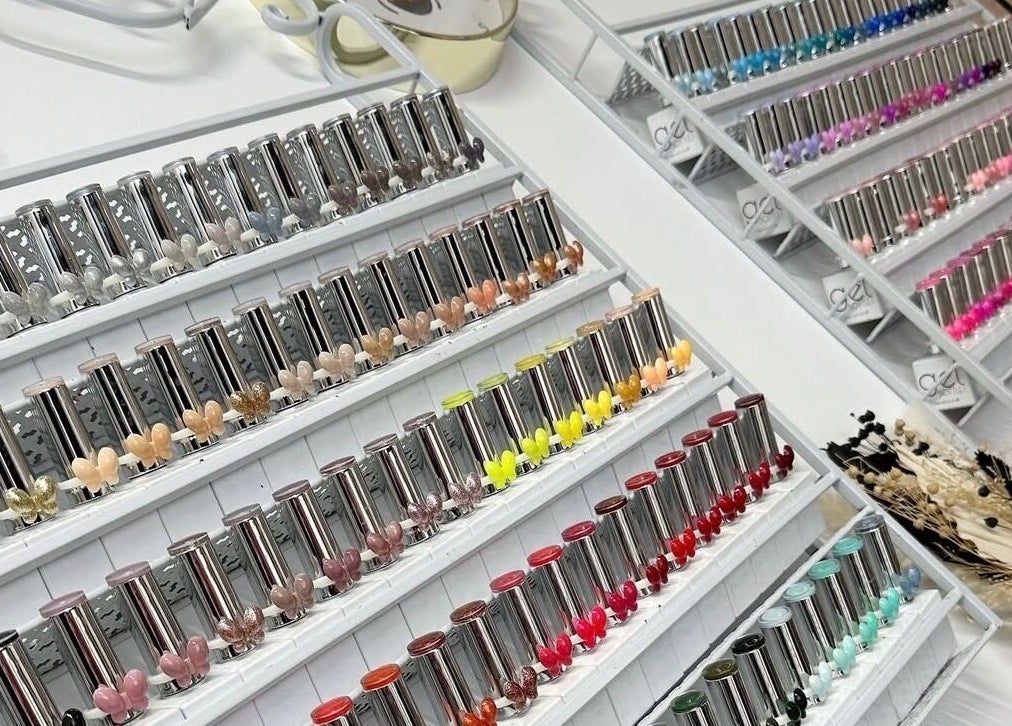 Colorful nail polish collection at Beehive By Charlotte in New Tupton, England, GB, showcasing vibrant options.
