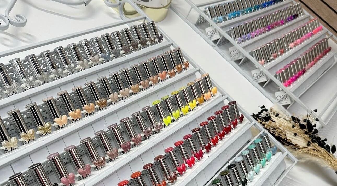Colorful nail polish collection at Beehive By Charlotte in New Tupton, England, GB, showcasing vibrant options.