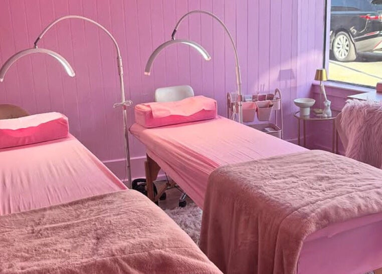 Cozy dual treatment beds in pink decor at Lotties Lashes, Sudbury, England, GB, showcasing inviting ambiance.