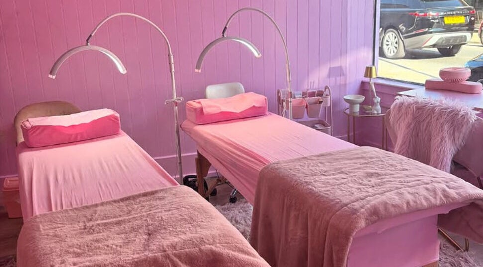 Cozy dual treatment beds in pink decor at Lotties Lashes, Sudbury, England, GB, showcasing inviting ambiance.