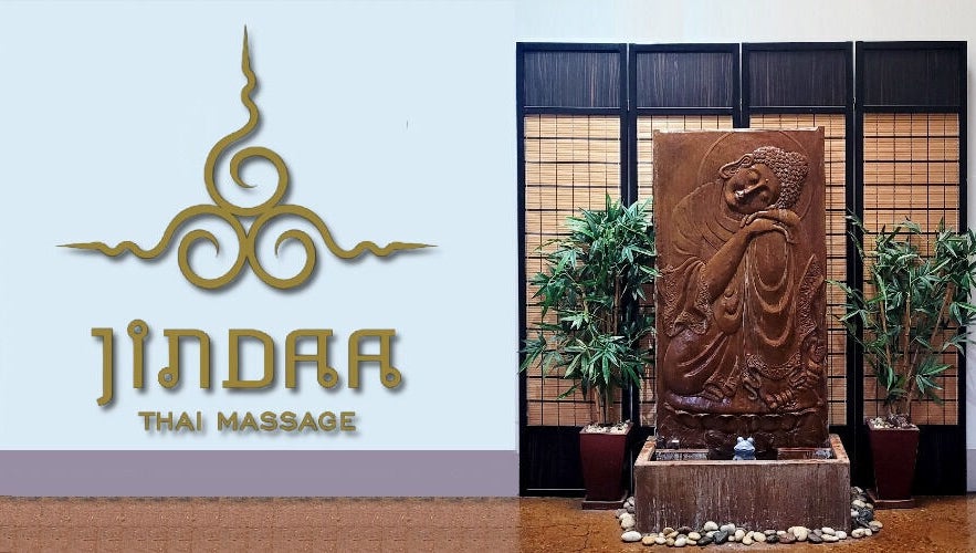 Jindaa Thai Massage entrance with serene sculpture and bamboo decor in Bendigo, Victoria, AU.