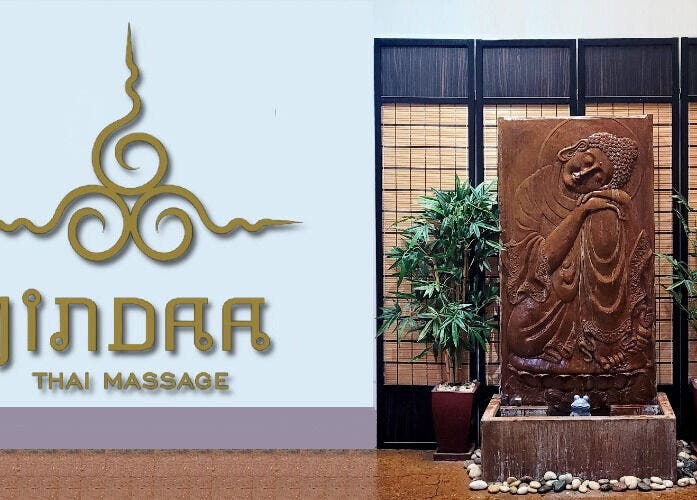 Jindaa Thai Massage entrance with serene sculpture and bamboo decor in Bendigo, Victoria, AU.
