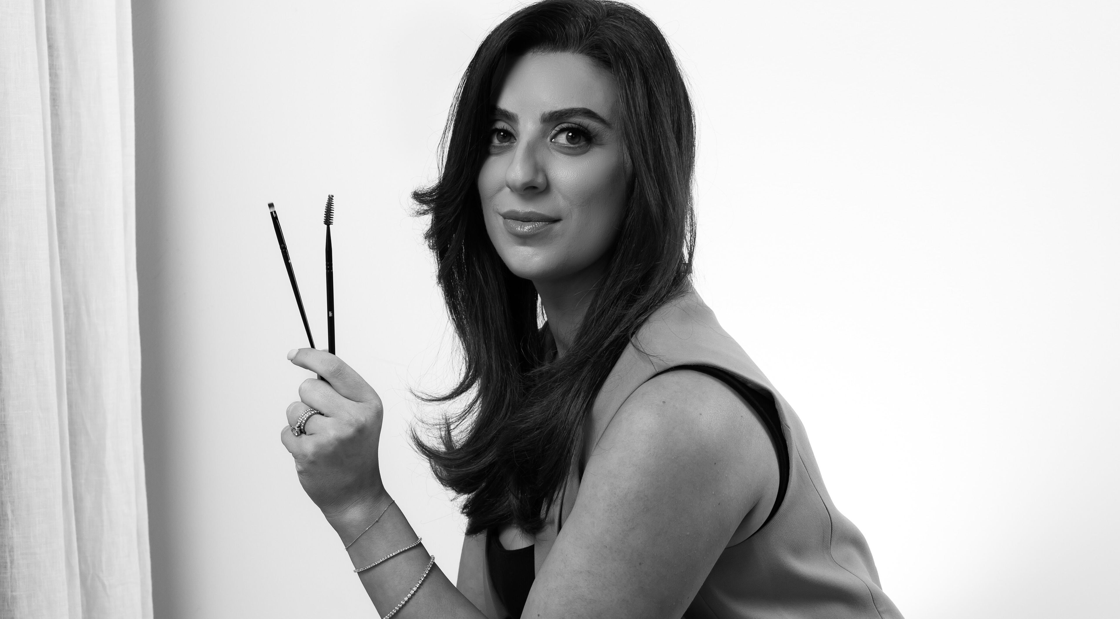 JSbrowbar_ makeup artist in Melbourne, Victoria, AU holding brow tools and smiling confidently.