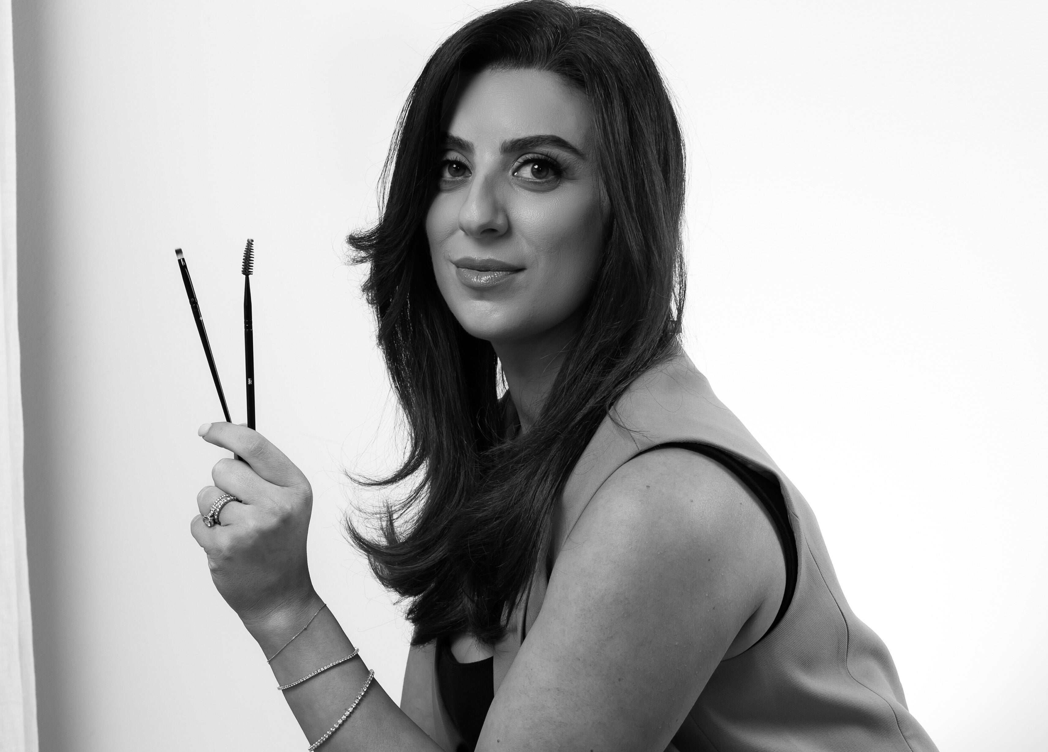 Professional beautician holding tools at J Sbrowbar Sydney, Winston Hills, New South Wales, AU.